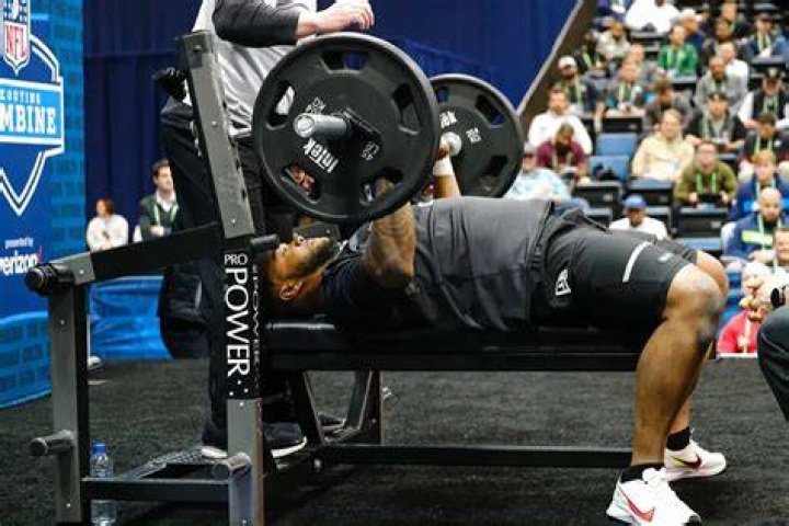 How many times did Christian McCaffrey bench press?